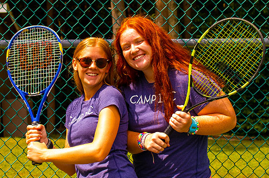 Tennis Coach, Summer Camps often have multiple tennis courts and run structured sessions throughout the day.