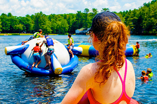 Lifeguards at a USA Summer Camp supervise swimming sessions at lakes or pools